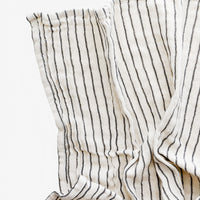 Cream / Black: Gauzy cotton tea towel in natural cotton with vertical black stripes