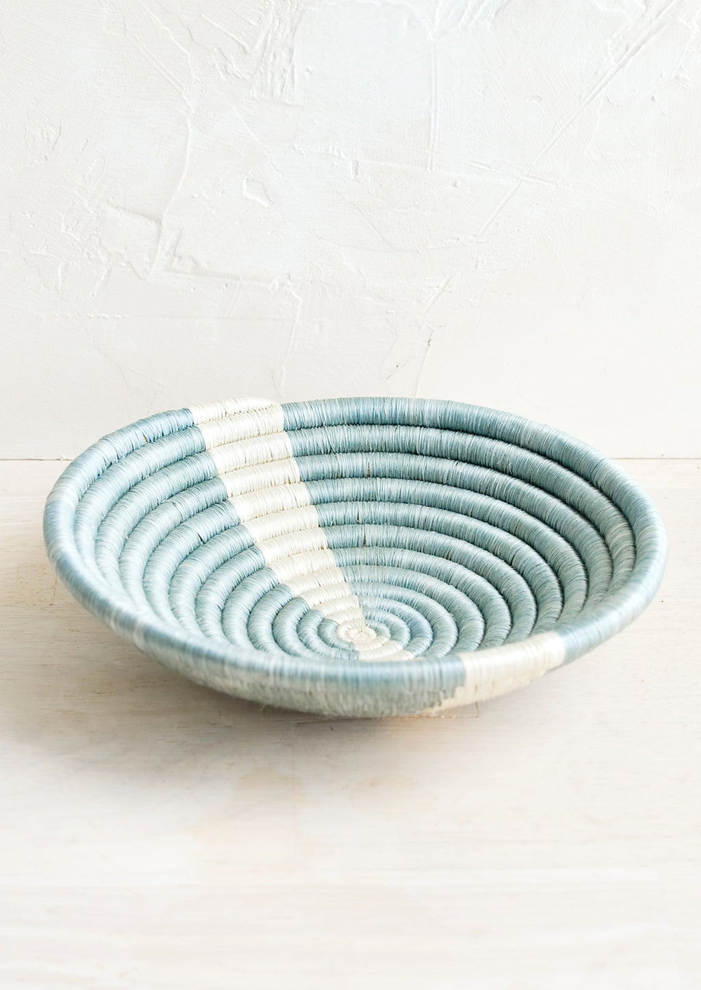 Dusty Blue / White: A small sweetgrass catchall bowl in blue with white stripe.