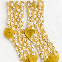 Yellow: A pair of non-sheer yellow socks with allover white daisy pattern.