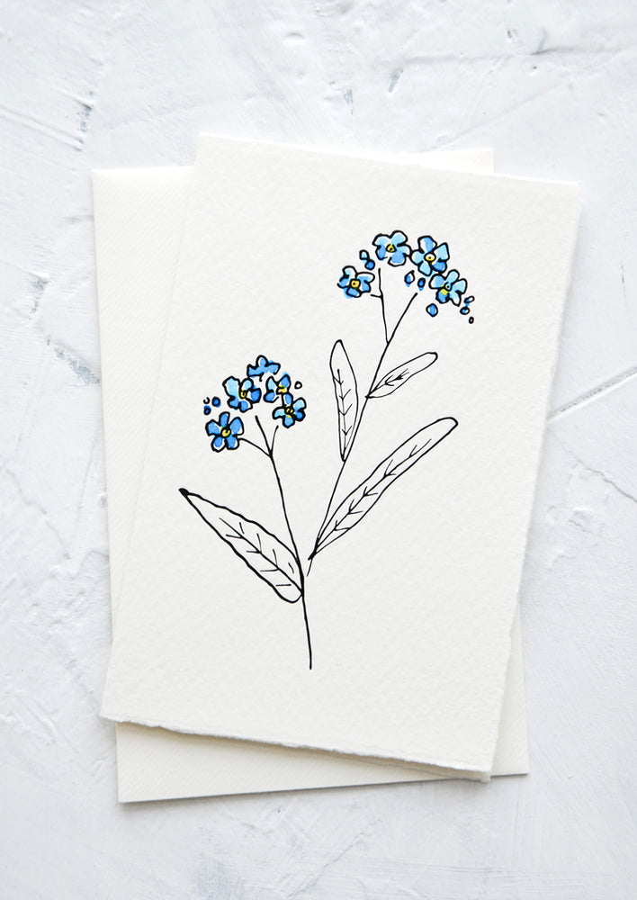 1: A letterpress printed greeting card made from hand-torn paper with hand-painted flower on front.