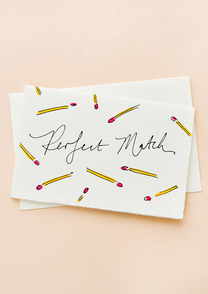 1: A white greeting card with hand-painted match sticks and "Perfect Match" written in cursive.