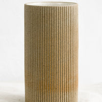 2: A sand brown cylindrical ceramic vase.