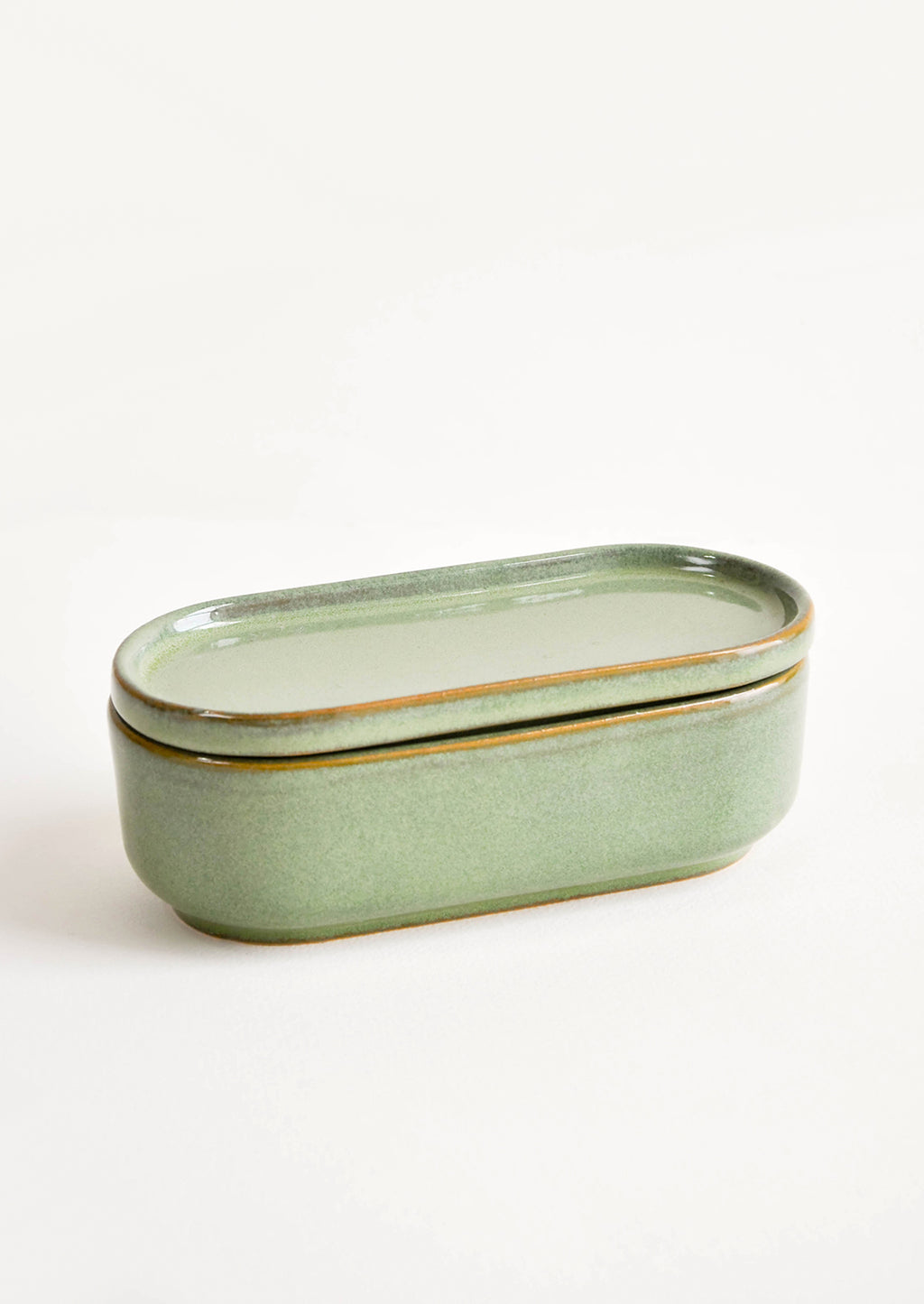 1: Oblong oval green Ceramic Container with Lid.