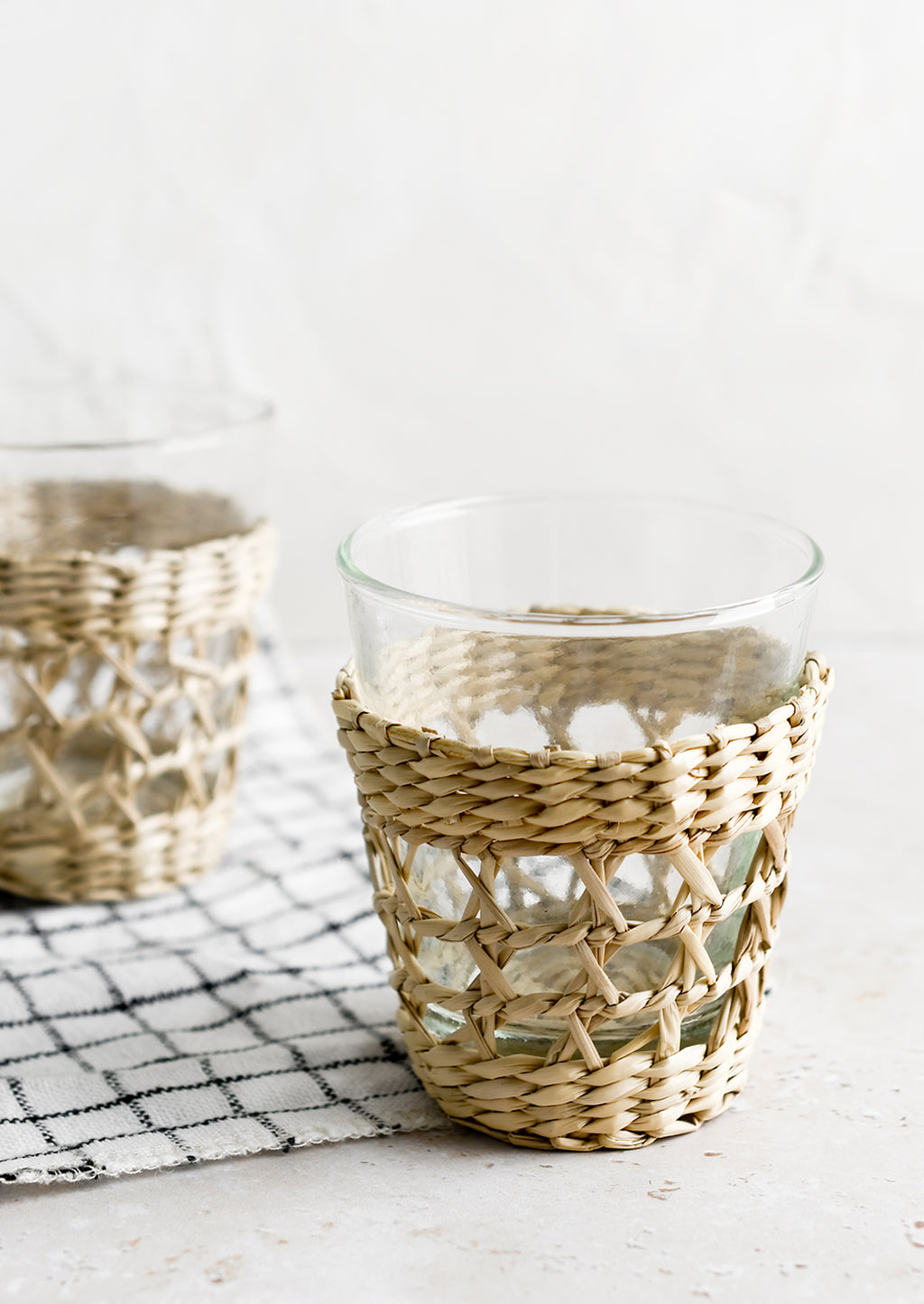Small / 6 oz: Small glass cups wrapped in decorative seagrass cage.