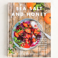 1: A hardcover cookbook with image of beet salad on cover.