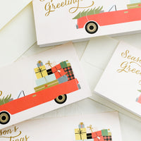 Boxed Set Of 8: Rectangular greeting cards with car full of presents, text reads "Season's greetings".