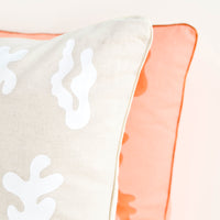 2: Close up of metallic and iridescent trim detail on printed throw pillows