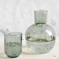Smoke: A glass carafe with lid/cup in grey.