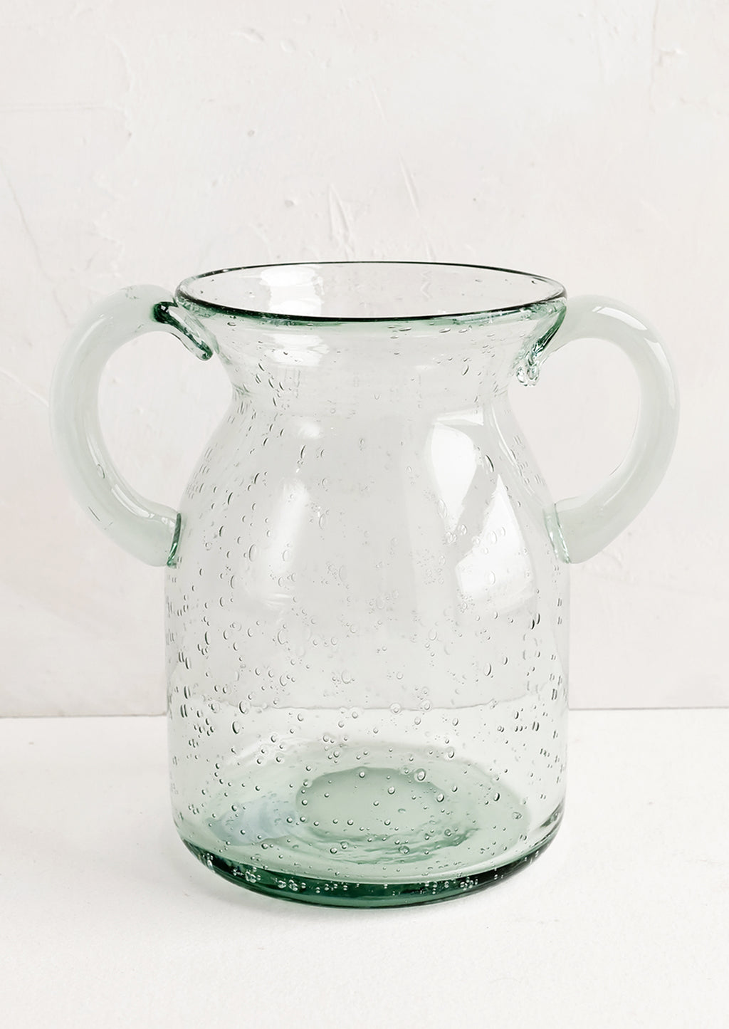 2: A clear, jug-shaped glass vase.