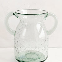 2: A clear, jug-shaped glass vase.