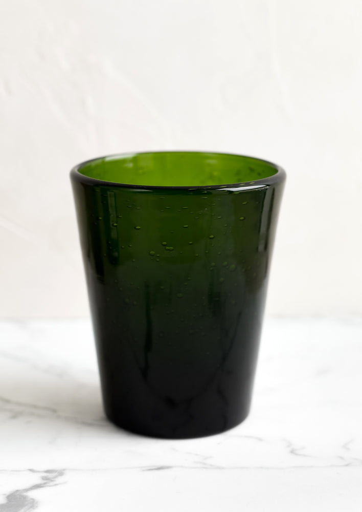 Kelp: A glass tumbler cup in green seeded glass.