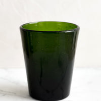 Kelp: A glass tumbler cup in green seeded glass.