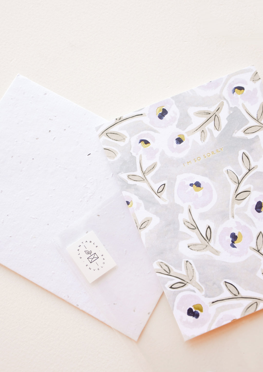 2: Greeting card with floral illustration and "i'm so sorry" written in small gold foil.