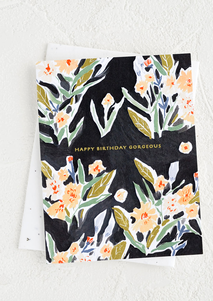 1: A greeting card with black background and floral print, gold text at center reads "Happy Birthday Gorgeous".
