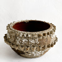 1: Distressed ceramic planter in chippy brown and white glaze with textured applique