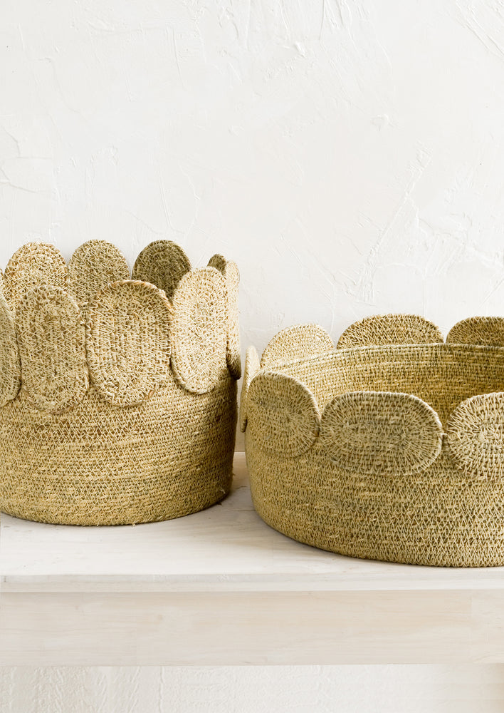 1: Two seagrass storage baskets in low and tall sizes.