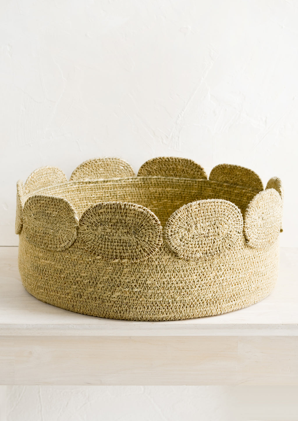 Wide: A shallow circular seagrass storage basket.