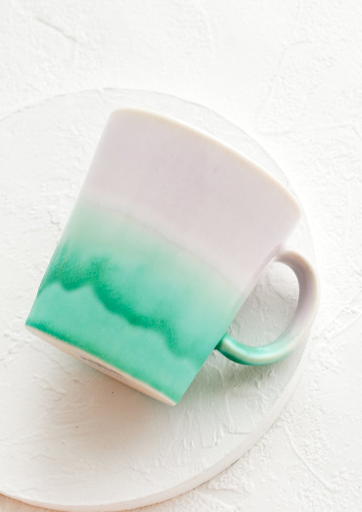 Lilac / Sea Green: A ceramic coffee mug with handle in lavender and sea green glaze.