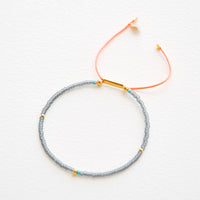 Grey / Neon Orange: Frosted Seed Beaded Bracelet in Grey / Neon Orange - LEIF