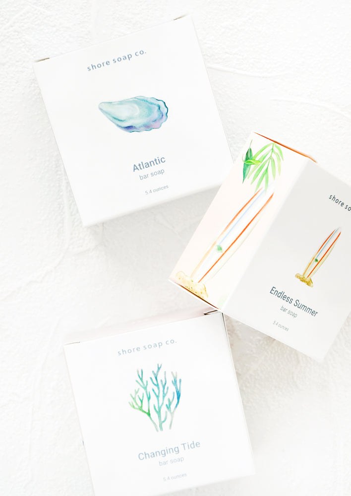Square box packaging for bar soaps with nautical inspired designs