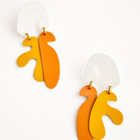Cream Multi: Dangling post earrings with orange and yellow organic seaweed shapes hanging from a white arced shape, connected by small brass rings.