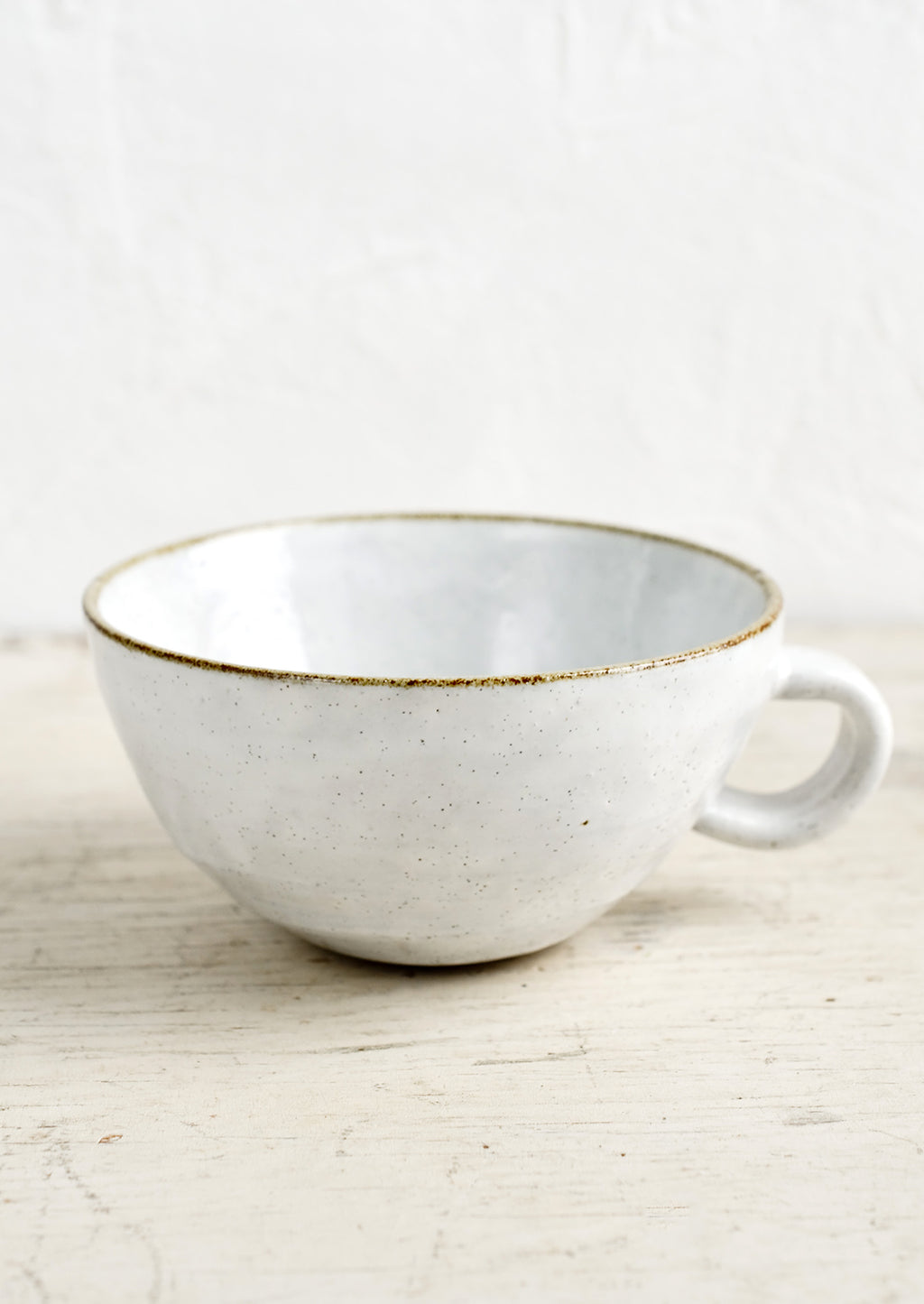 Glossy White / Latte Mug: A ceramic latte mug in a glossy white glaze with soft speckles.