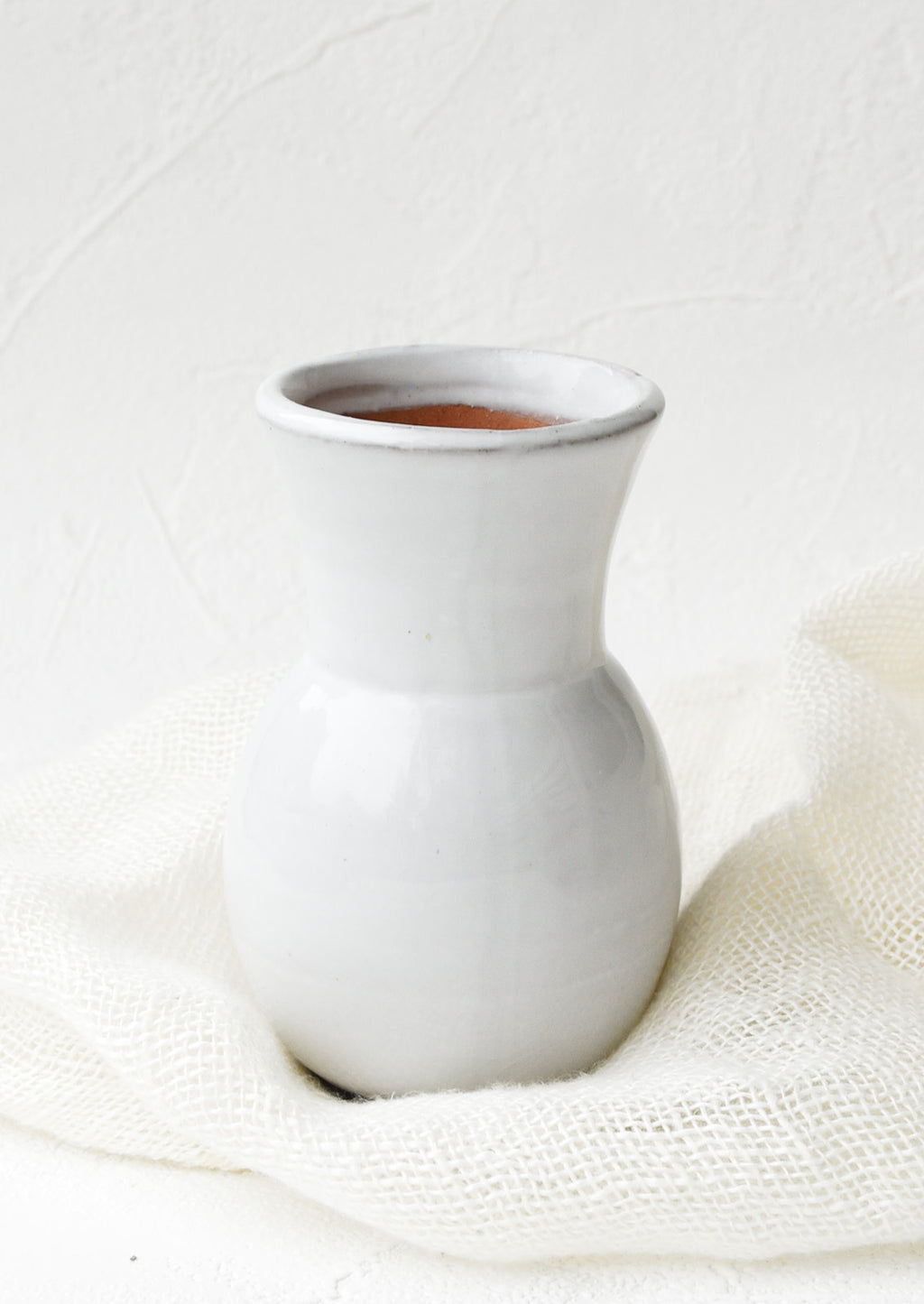 Mini [$14.99]: Glossy white ceramic vase with wide bottom and tapered top