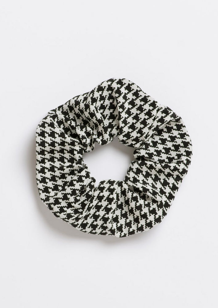 A silk scrunchie in black and white houndstooth.