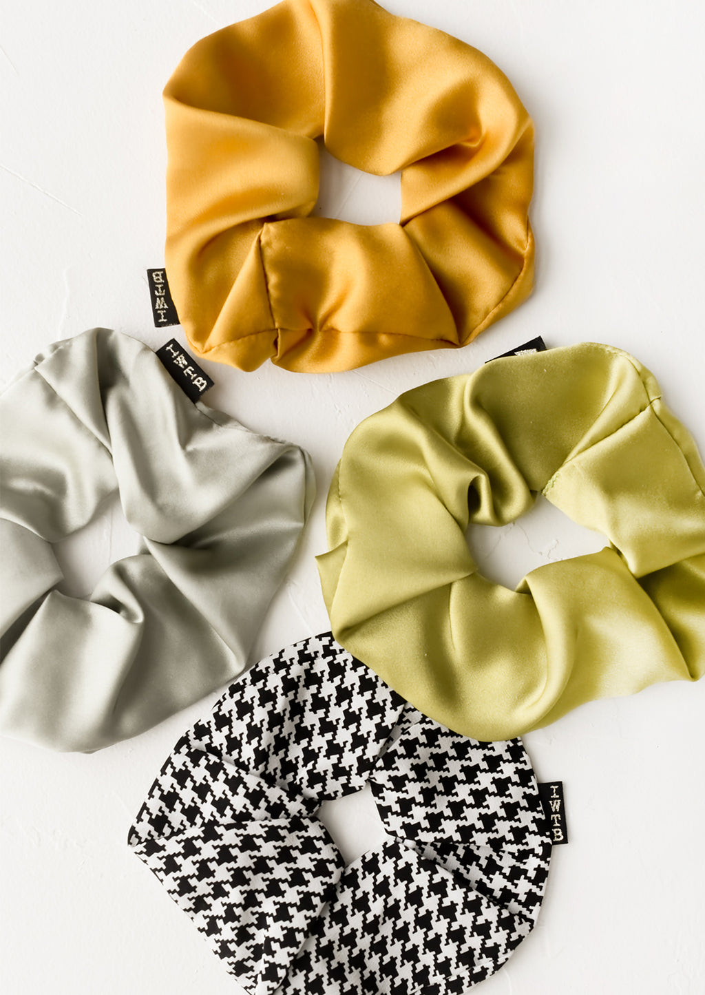 2: Silk scrunchies in assorted colors.