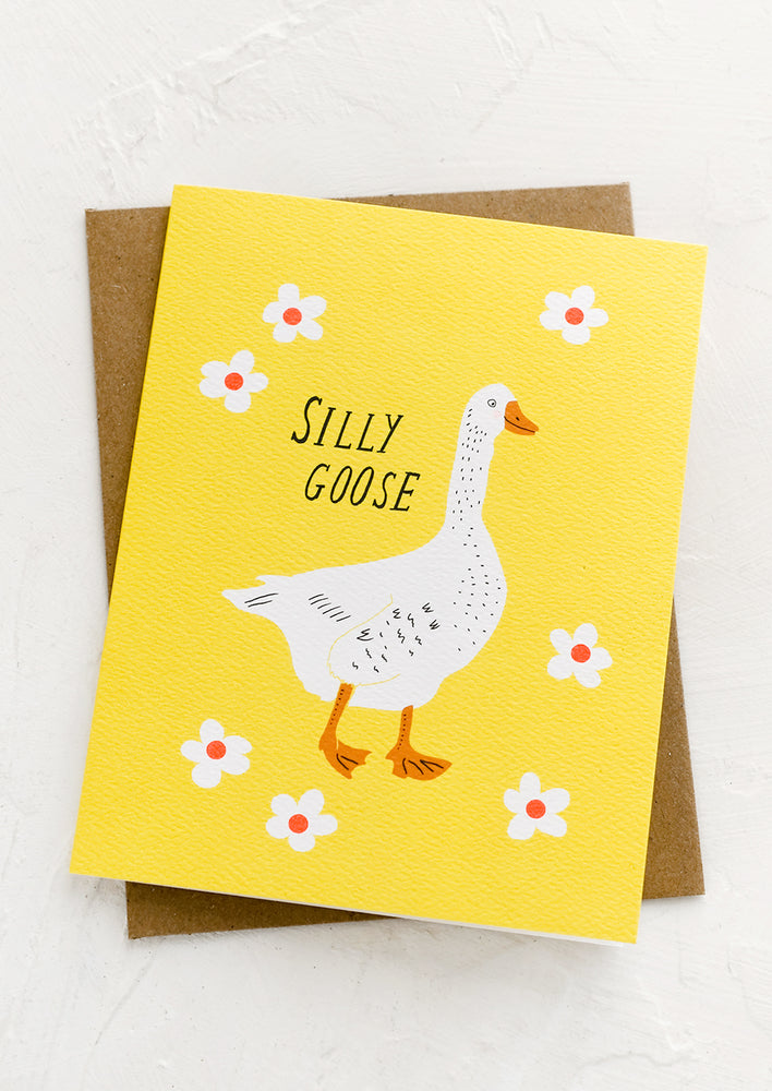 A greeting card with illustration of goose and text reading "Silly goose".