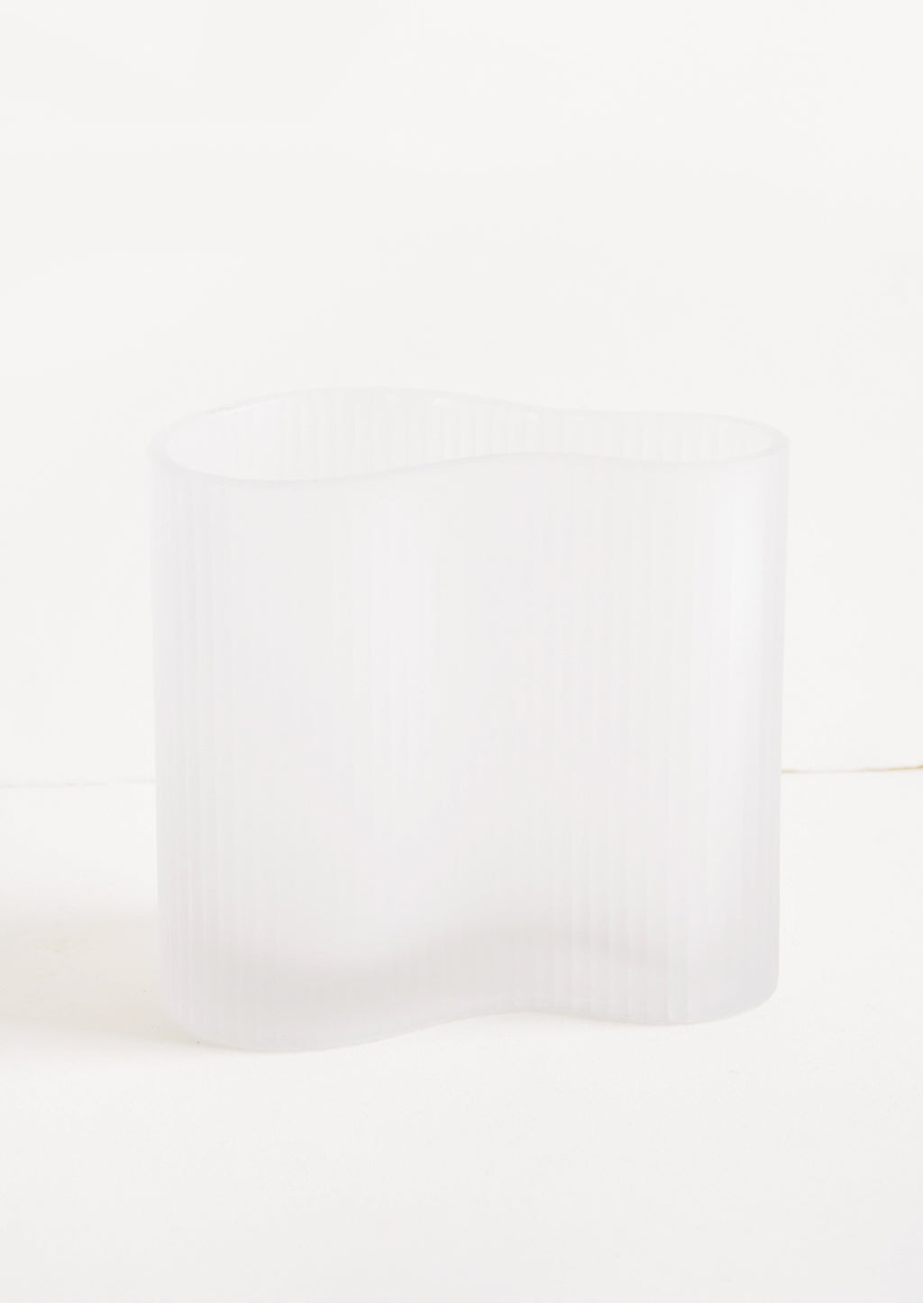 2: Frosted glass vase in curvy asymmetric shape with subtle ribbed texture