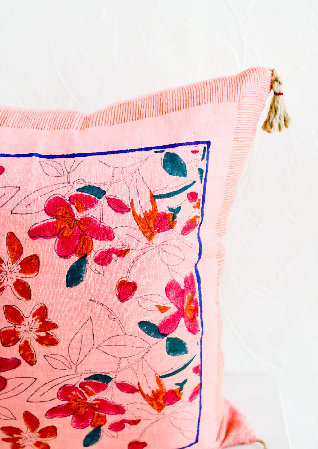 3: An intricate block printed floral pattern on a linen pillow.