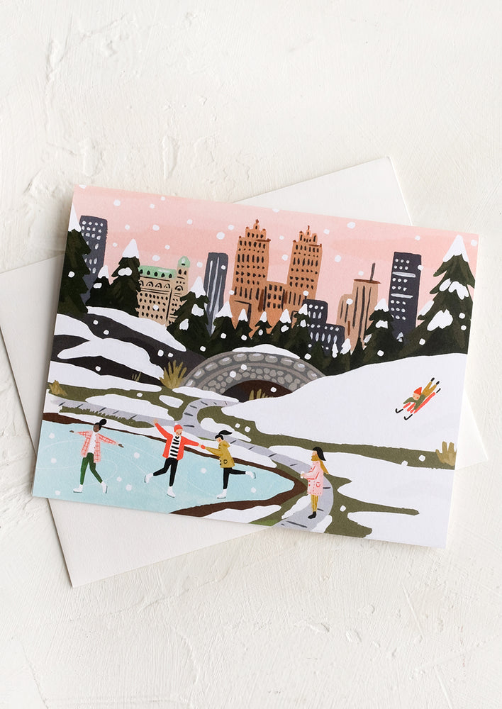 1: An illustrated greeting card depicting ice skaters in central park.