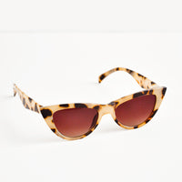 1: Cat eye sunglasses with tortoiseshell frame and tinted lenses.