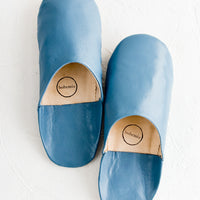 Marine / Medium: A pair of leather house slippers in marine blue.