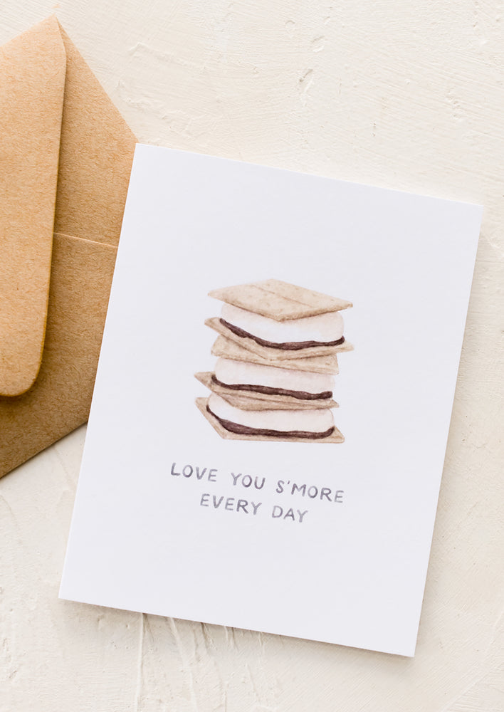 A greeting card with image of stack of s'mores, text reads "Love you s'more every day".