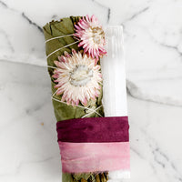 Pink Multi: A eucalyptus and selenite smudge bundle bound with pink ribbon.