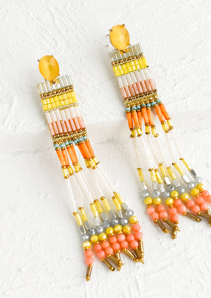 A pair of beaded earrings with faceted gem post.