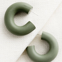 Aloe: A pair of polymer clay hoop earrings in aloe green..
