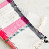 1: A woven cotton throw in a mix of colors and stitches.