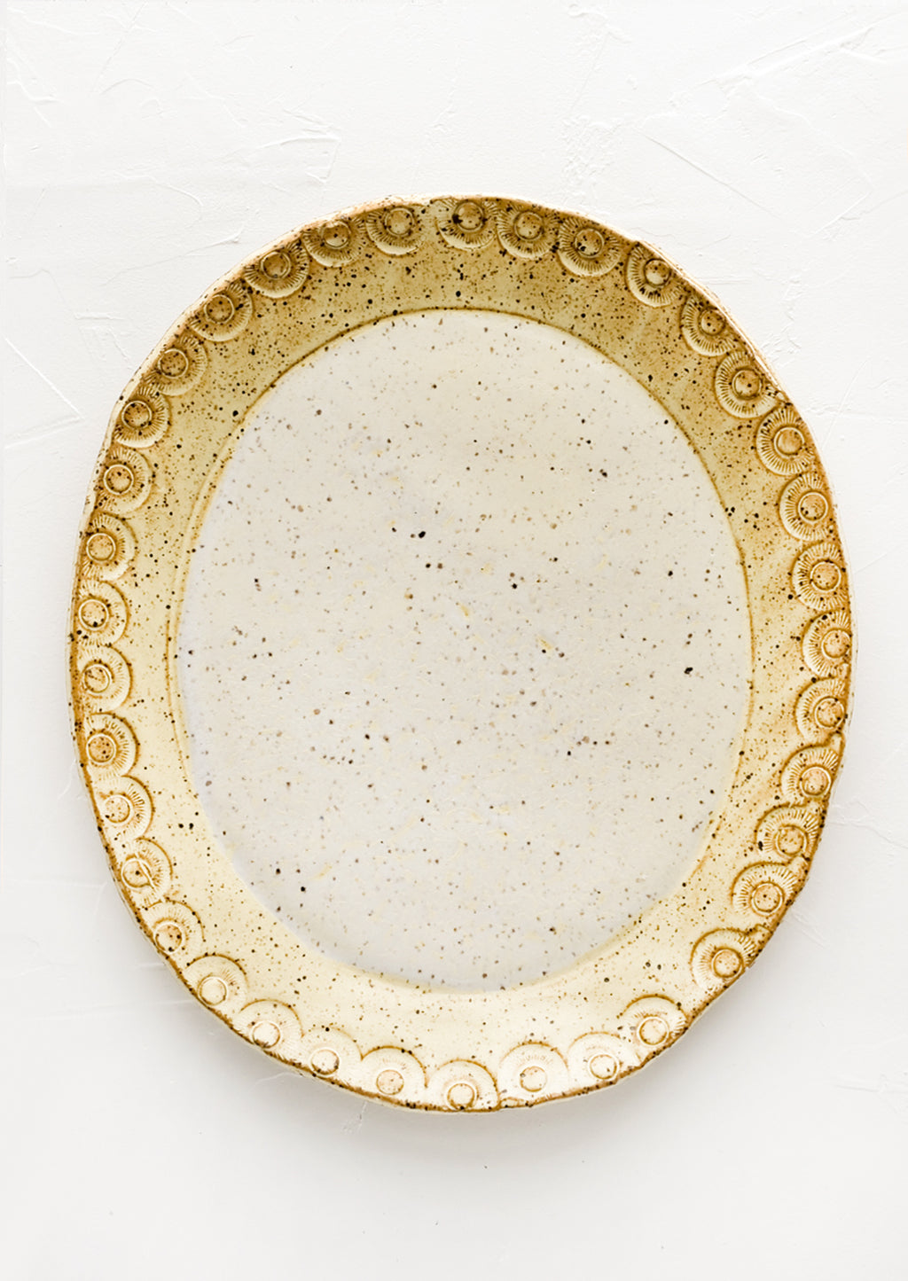 Buttermilk Speckle: An oval shaped ceramic platter in pale yellow speckle.