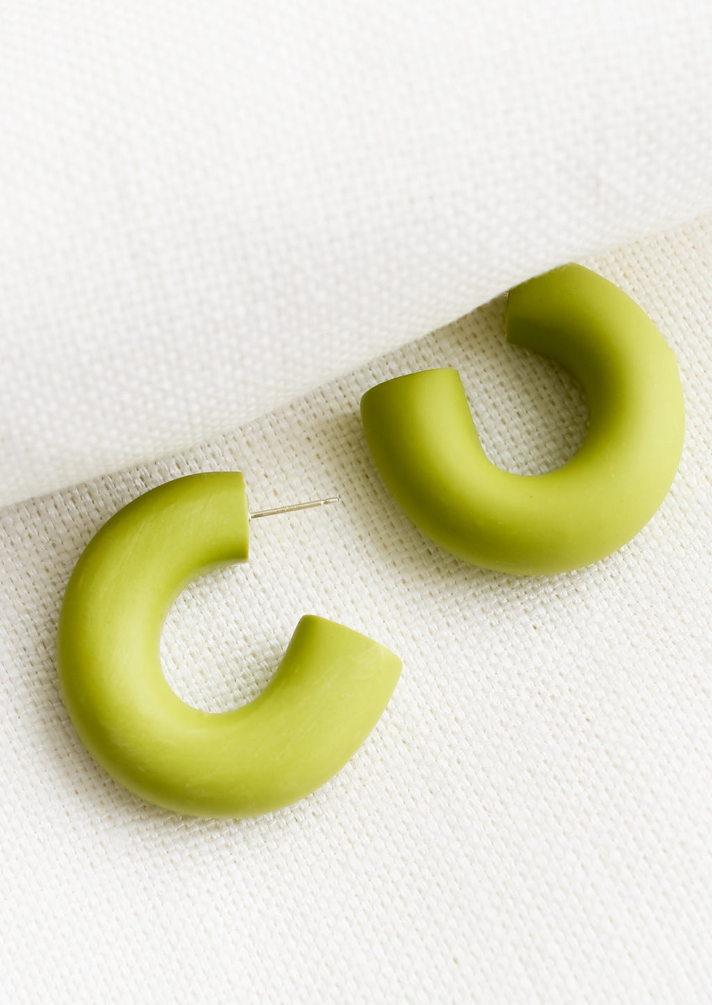 Green Apple: A pair of polymer clay hoop earrings in green apple.