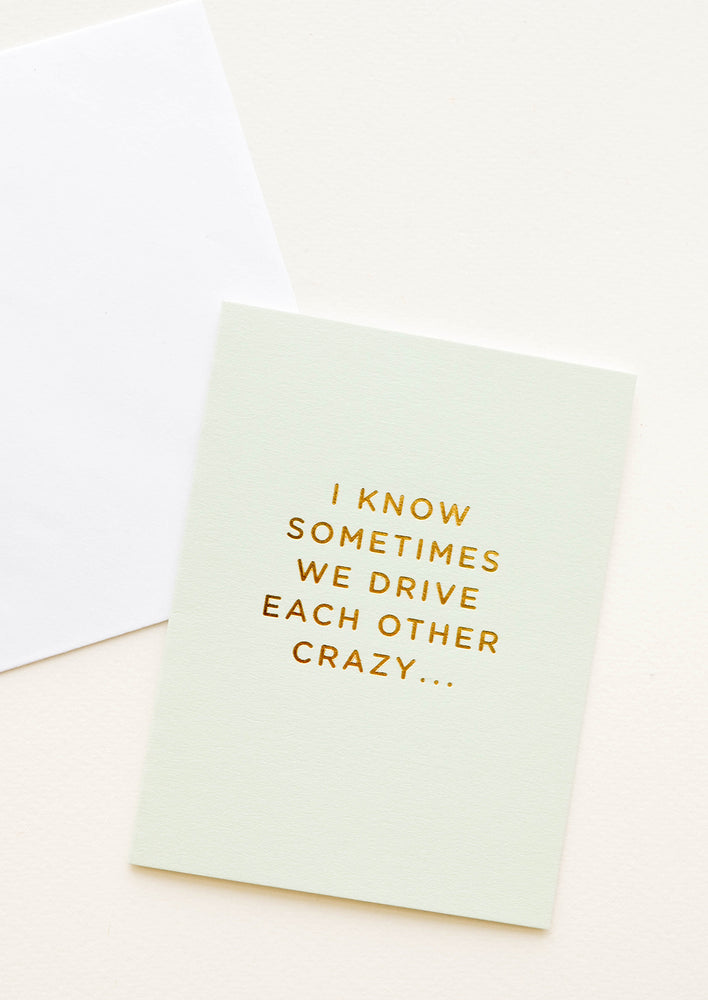 1: A pale green greeting card with script reading "I know sometimes we drive each other crazy" in gold foil.