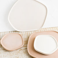 1: Concrete trays in asymmetrical shape in assorted sizes and colors.