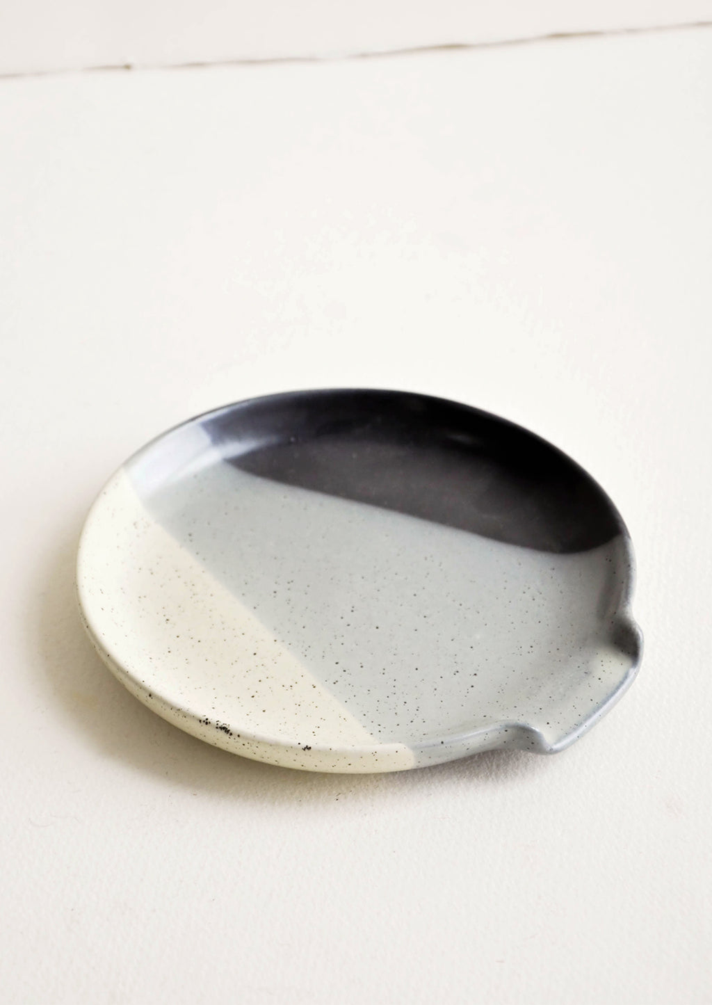 Tri-Tone Grey: Circular ceramic spoon rest in tri-color glaze of ivory, grey and black