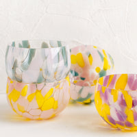 2: Speckled glass bowls in assorted colors.