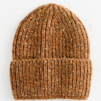 Auburn Multi: A knit beanie hat with cuffed rim made in auburn yarn with  speckles.
