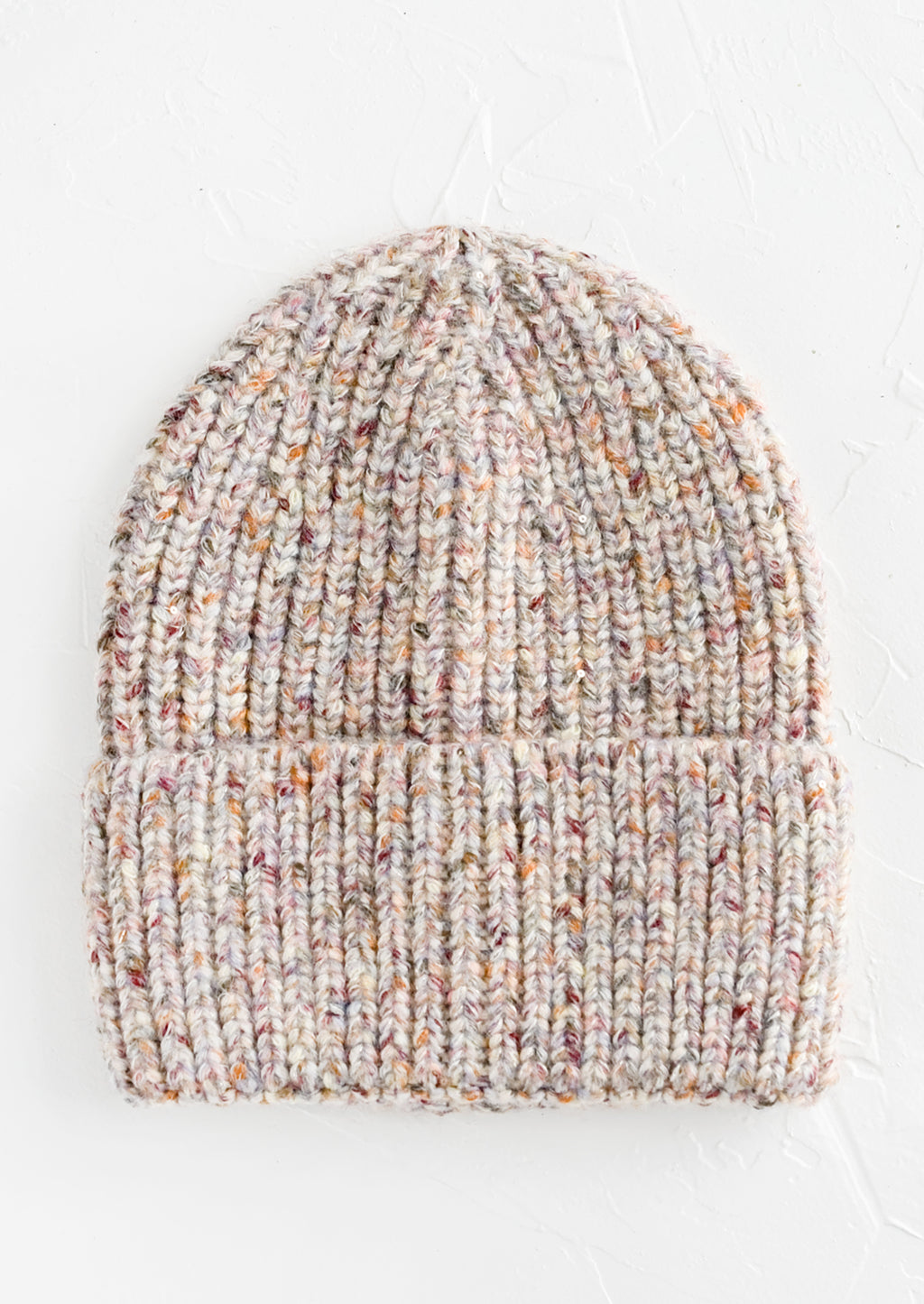 Ivory Multi: A knit beanie hat with cuffed rim made in multicolor speckled ivory yarn.