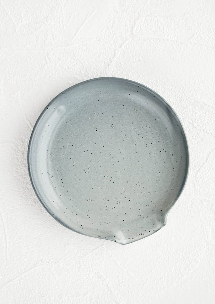 Grey: Circular ceramic spoon rest in grey with tiny black speckles