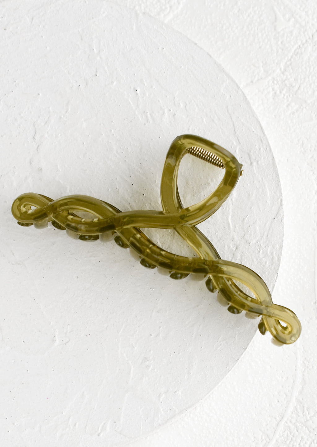 Olive: A spiral shaped hair claw in olive green.